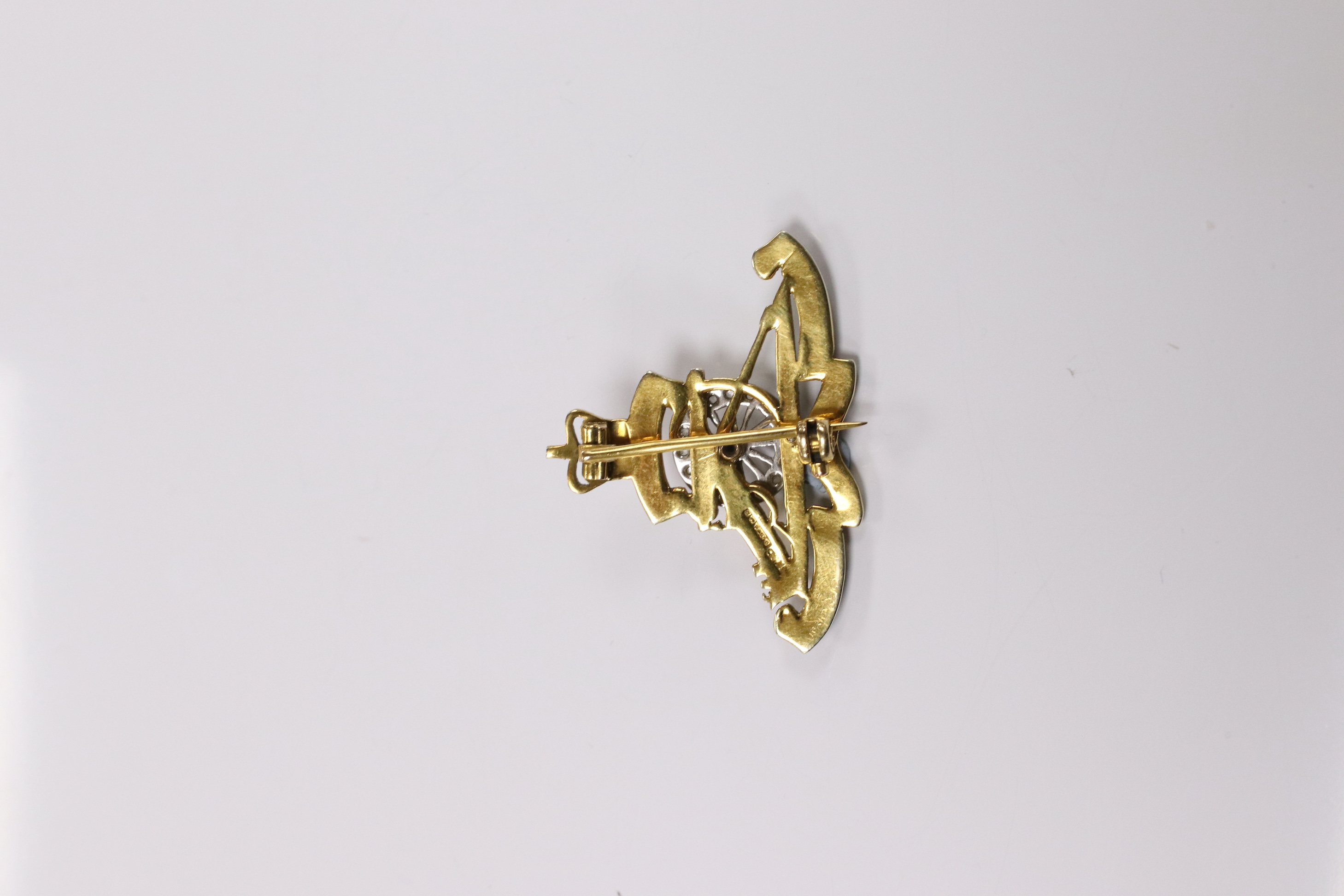 A mid 20th century 9ct gold, diamond and two colour enamel set Royal Artillery sweethearts brooch, 36mm, gross weight 5.7 grams. Condition - poor to fair